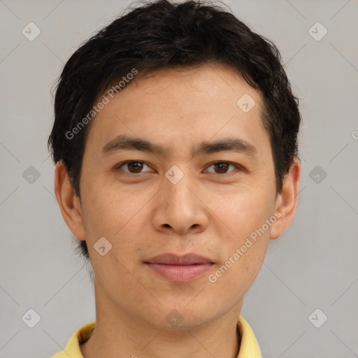 Joyful asian young-adult male with short  brown hair and brown eyes