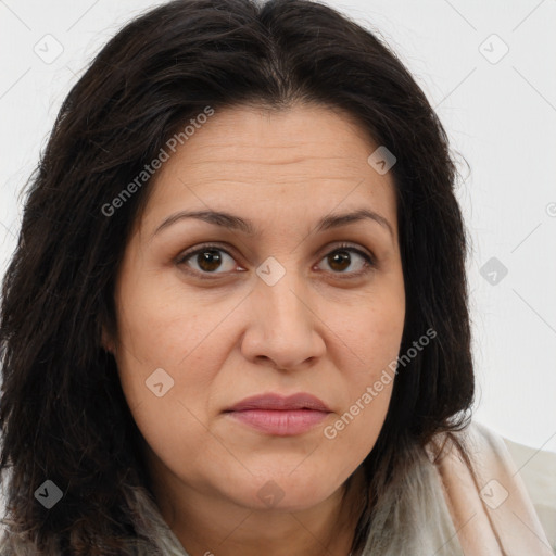 Joyful white adult female with long  brown hair and brown eyes