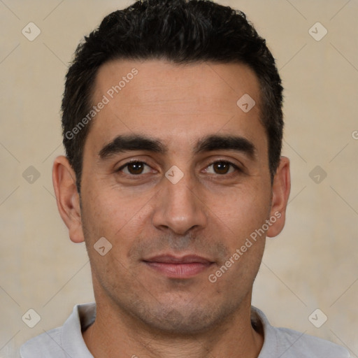 Joyful white young-adult male with short  black hair and brown eyes