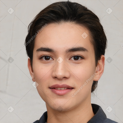 Joyful white young-adult male with short  black hair and brown eyes