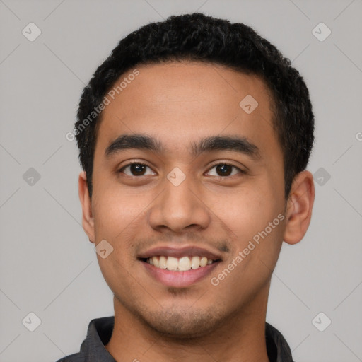 Joyful latino young-adult male with short  black hair and brown eyes