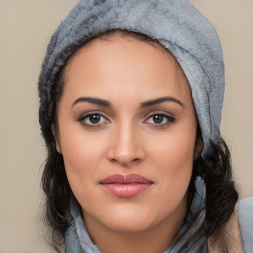 Joyful white young-adult female with long  black hair and brown eyes