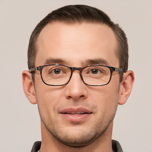 Joyful white young-adult male with short  brown hair and brown eyes