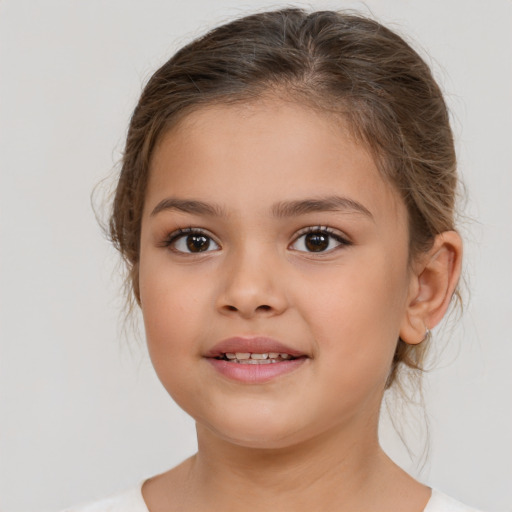 Joyful white child female with medium  brown hair and brown eyes