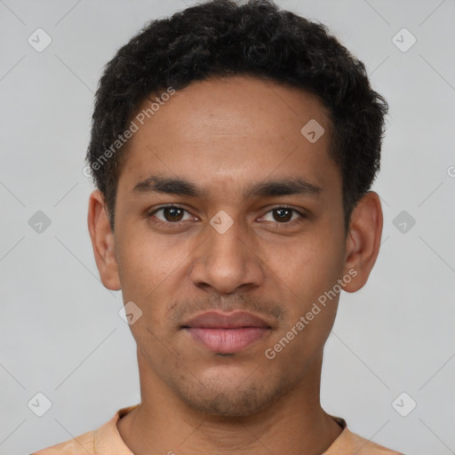 Joyful latino young-adult male with short  brown hair and brown eyes