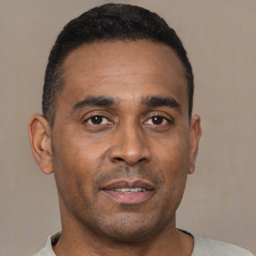 Neutral black young-adult male with short  black hair and brown eyes