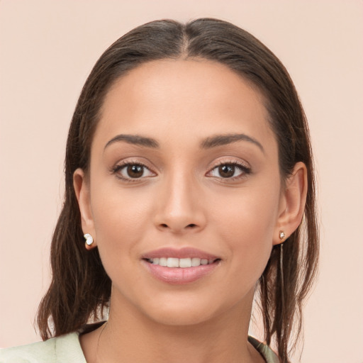 Joyful white young-adult female with long  brown hair and brown eyes