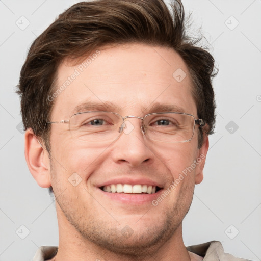 Joyful white adult male with short  brown hair and grey eyes