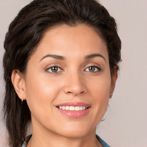 Joyful white young-adult female with medium  brown hair and brown eyes