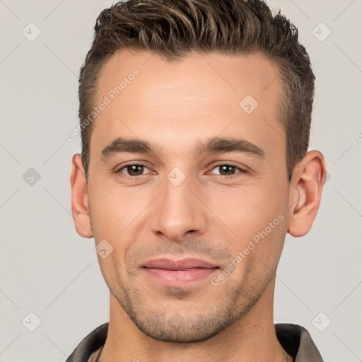 Joyful white young-adult male with short  brown hair and brown eyes