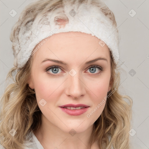 Joyful white young-adult female with medium  brown hair and blue eyes