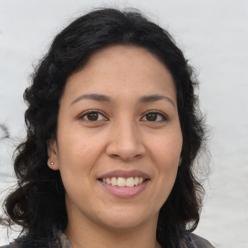 Joyful asian young-adult female with long  brown hair and brown eyes