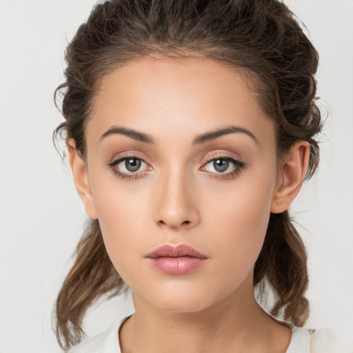 Neutral white young-adult female with medium  brown hair and brown eyes