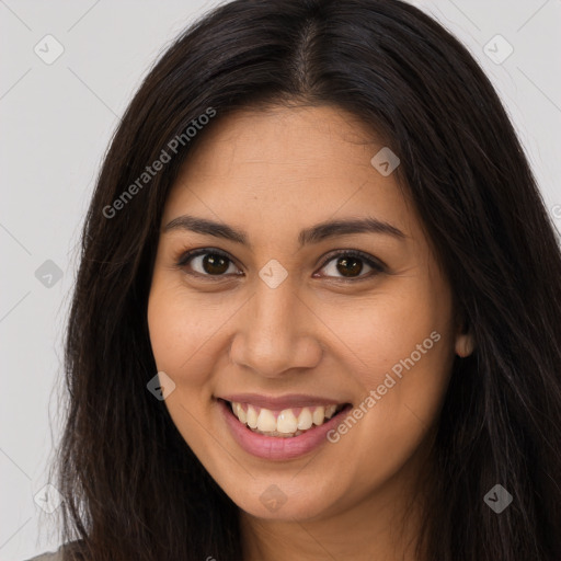 Joyful latino young-adult female with long  brown hair and brown eyes