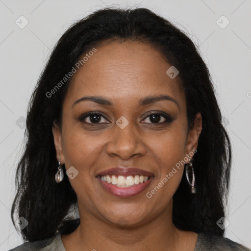 Joyful black young-adult female with long  brown hair and brown eyes