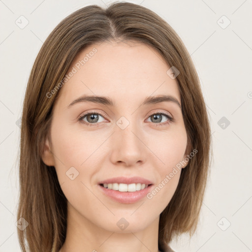 Joyful white young-adult female with long  brown hair and green eyes