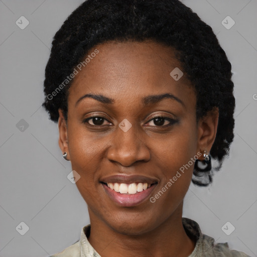 Joyful black young-adult female with short  black hair and brown eyes