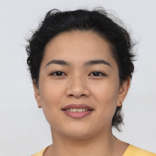 Joyful asian young-adult female with medium  brown hair and brown eyes