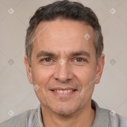 Joyful white adult male with short  brown hair and brown eyes