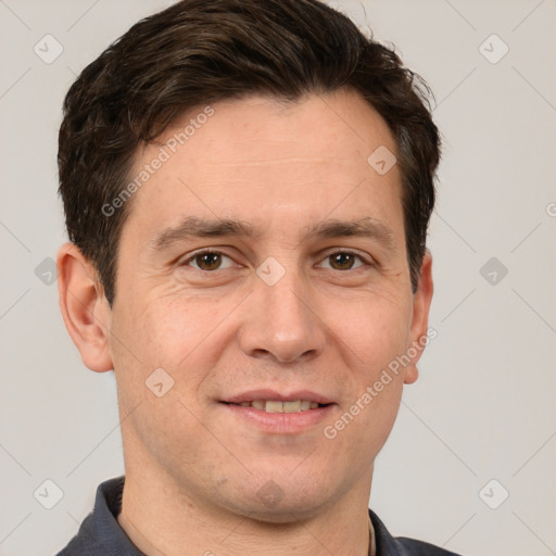 Joyful white adult male with short  brown hair and brown eyes