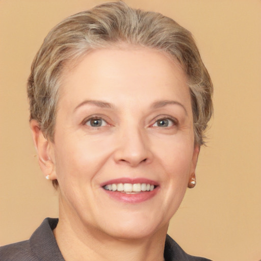 Joyful white adult female with short  brown hair and grey eyes