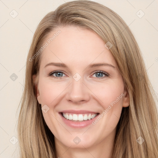 Joyful white young-adult female with long  brown hair and blue eyes