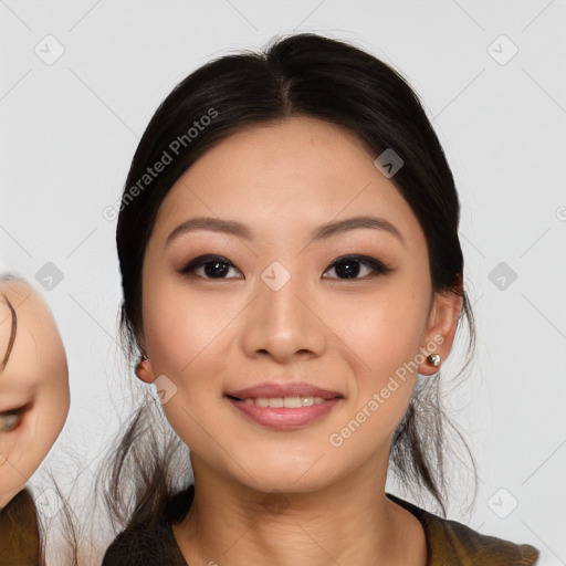 Joyful asian young-adult female with long  brown hair and brown eyes