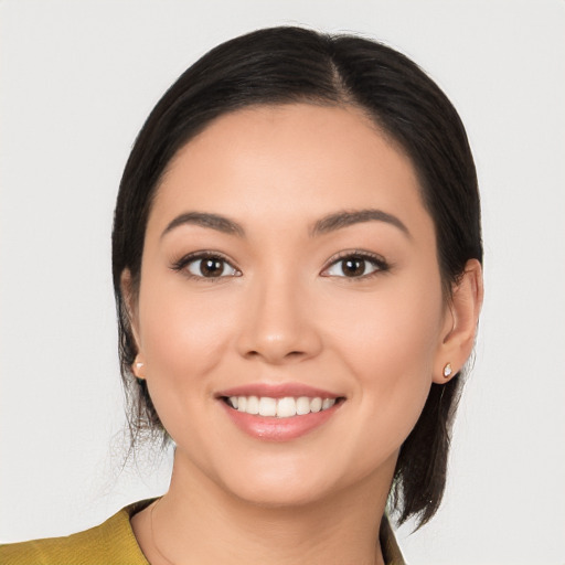 Joyful white young-adult female with medium  black hair and brown eyes