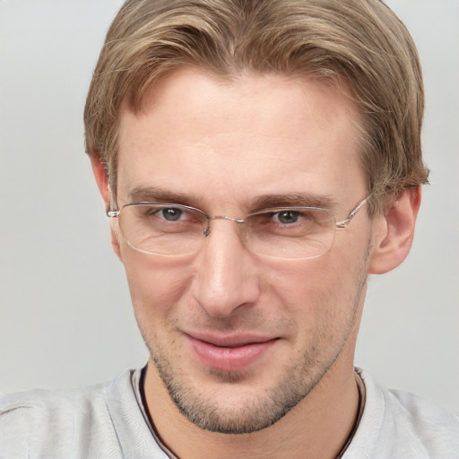 Joyful white adult male with short  brown hair and grey eyes