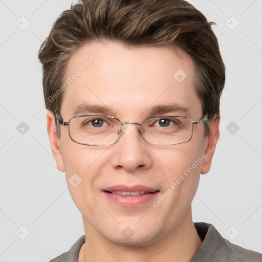 Joyful white adult male with short  brown hair and grey eyes