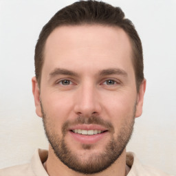 Joyful white young-adult male with short  brown hair and brown eyes