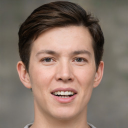 Joyful white adult male with short  brown hair and brown eyes