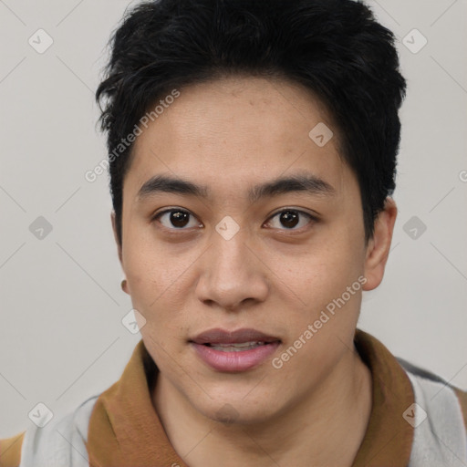 Joyful asian young-adult male with short  black hair and brown eyes