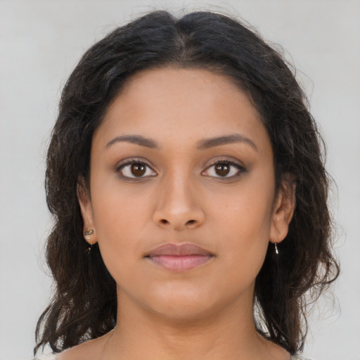 Neutral latino young-adult female with long  brown hair and brown eyes