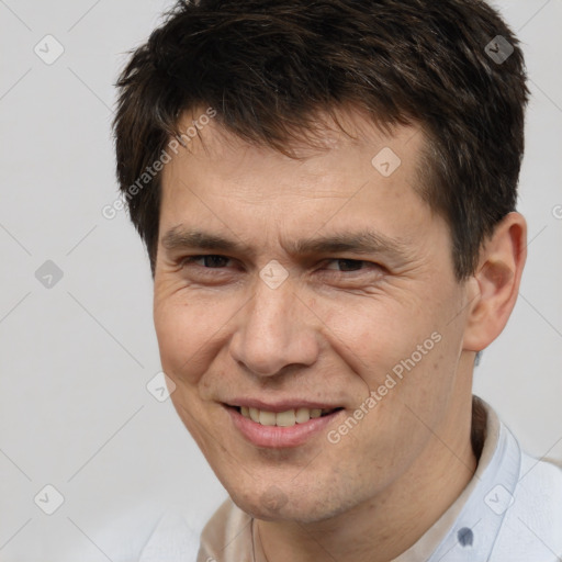 Joyful white adult male with short  brown hair and brown eyes