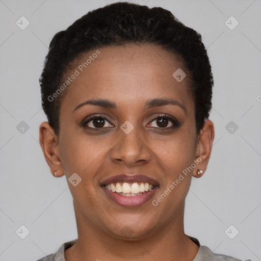 Joyful black young-adult female with short  brown hair and brown eyes