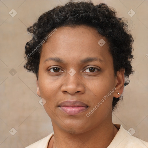 Joyful black adult female with short  brown hair and brown eyes