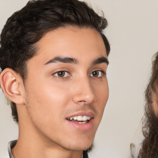 Joyful white young-adult male with medium  brown hair and brown eyes