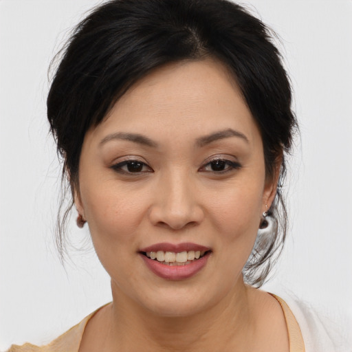 Joyful asian young-adult female with medium  brown hair and brown eyes