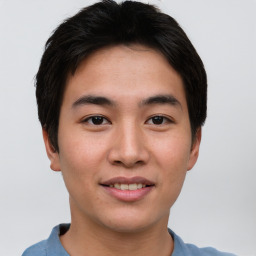 Joyful asian young-adult male with short  brown hair and brown eyes