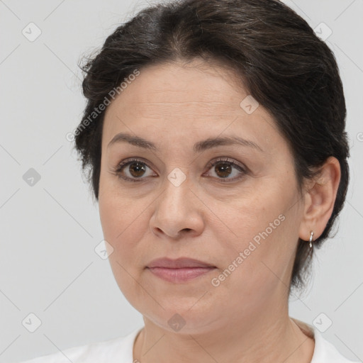 Joyful white adult female with medium  brown hair and brown eyes