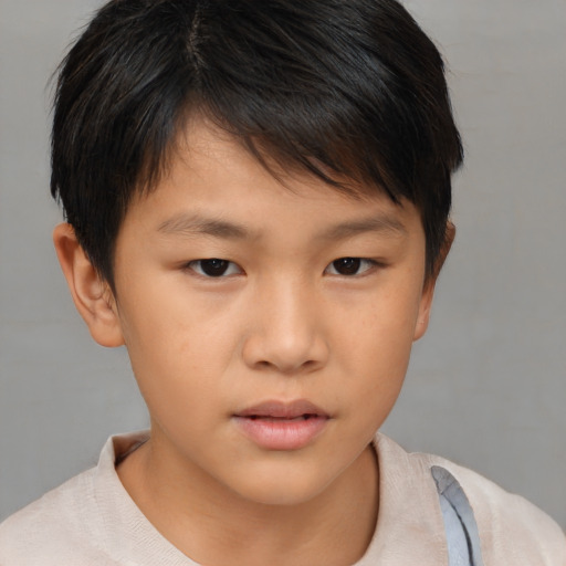 Neutral asian child male with short  brown hair and brown eyes