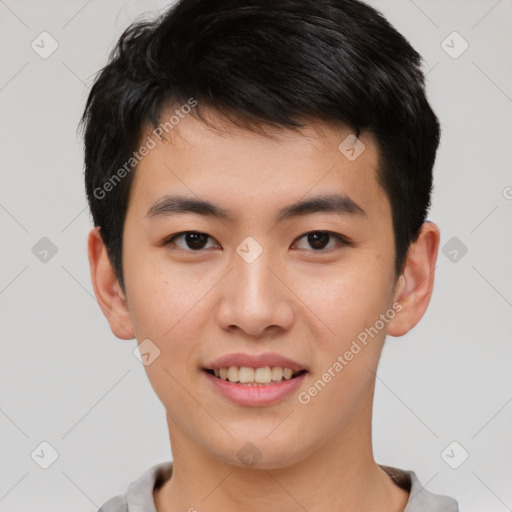 Joyful asian young-adult male with short  brown hair and brown eyes