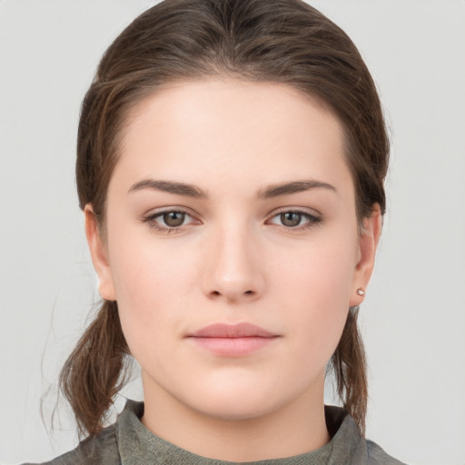 Neutral white young-adult female with medium  brown hair and brown eyes