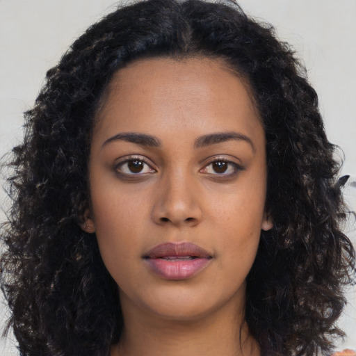 Neutral latino young-adult female with long  black hair and brown eyes