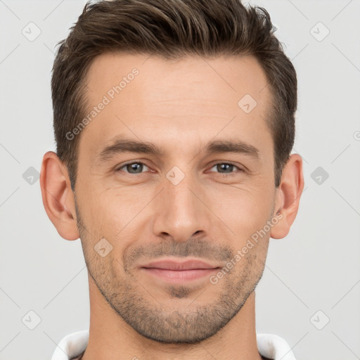 Joyful white young-adult male with short  brown hair and brown eyes