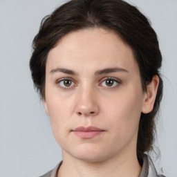 Neutral white young-adult female with medium  brown hair and brown eyes