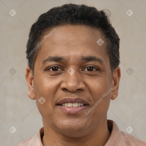 Joyful latino adult male with short  brown hair and brown eyes