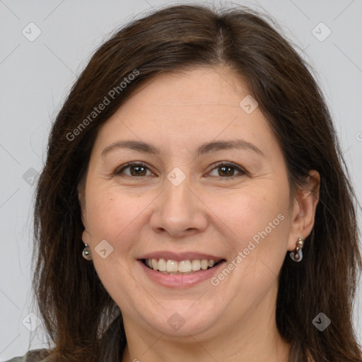 Joyful white adult female with long  brown hair and brown eyes