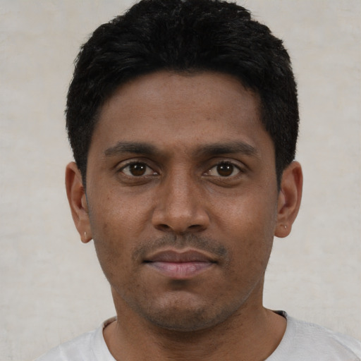 Neutral latino young-adult male with short  black hair and brown eyes
